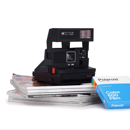 Vintage polaroid 640 instant camera - classic 600 film camera with built-in flash, fixed focus lens, lighten/darken control for retro photos