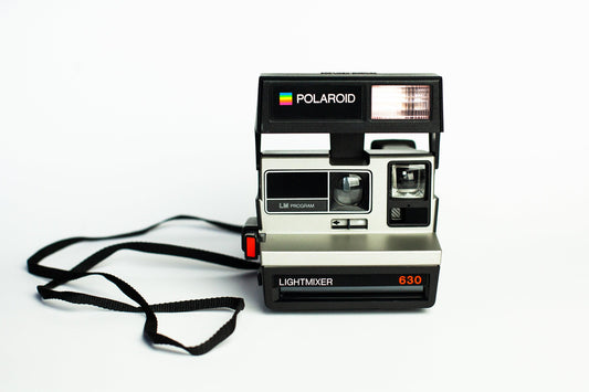 Vintage polaroid 630 sl lightmixer lm program - 600 film instant camera with auto flash, lighten/darken slider, and retro photography charm