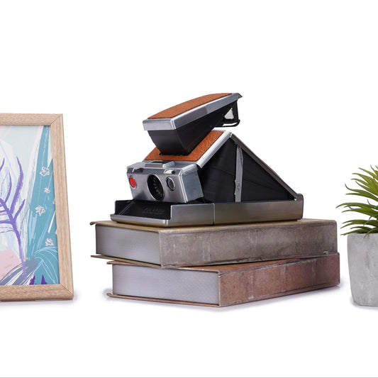 Vintage polaroid sx-70 instant camera - refurbished classic slr with manual focus and film shield
