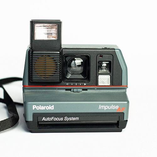 Polaroid impulse portrait instant film camera, vintage autofocus af, retro instant photography, classic 80s instant camera
