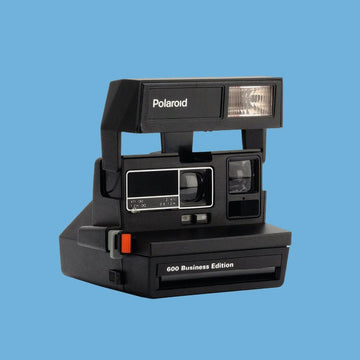 Polaroid 600 business edition instant camera, vintage polaroid 600 type, retro instant camera, classic polaroid camera, collectible camera