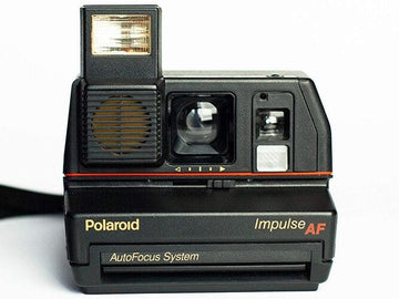 Old fashioned polaroid impulse autofocus af instant film camera black