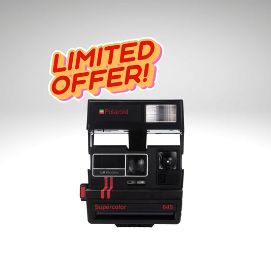 Polaroid vintage camera, old perfectly working instant camera, red polaroid camera
