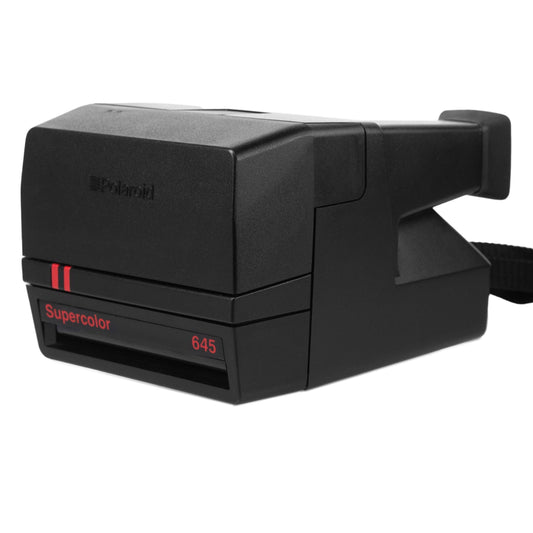 Polaroid vintage camera, old perfectly working instant camera, red polaroid camera
