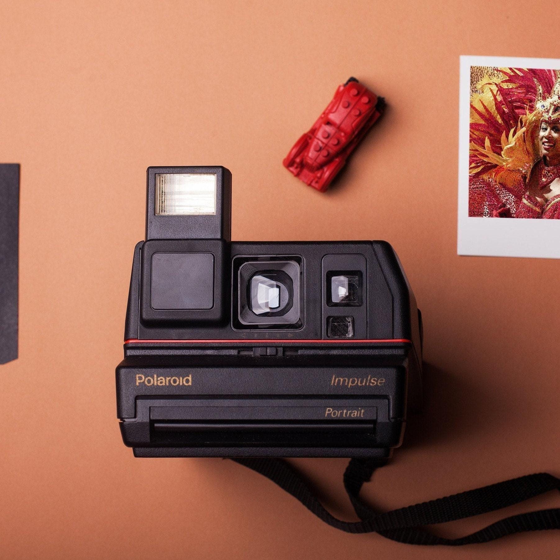 Polaroid impulse portrait instant film camera black - vintage 600 film camera with built-in flash, fixed focus lens, and retro design - Vintage Polaroid Instant Cameras