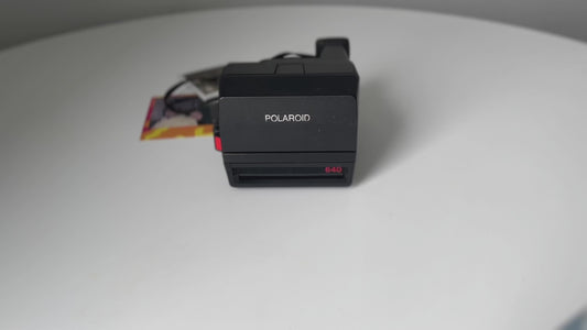Vintage polaroid 640 instant camera - classic 600 film camera with built-in flash, fixed focus lens, lighten/darken control for retro photos